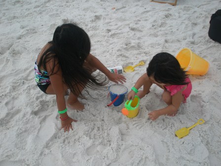 Girls playing in the sand
